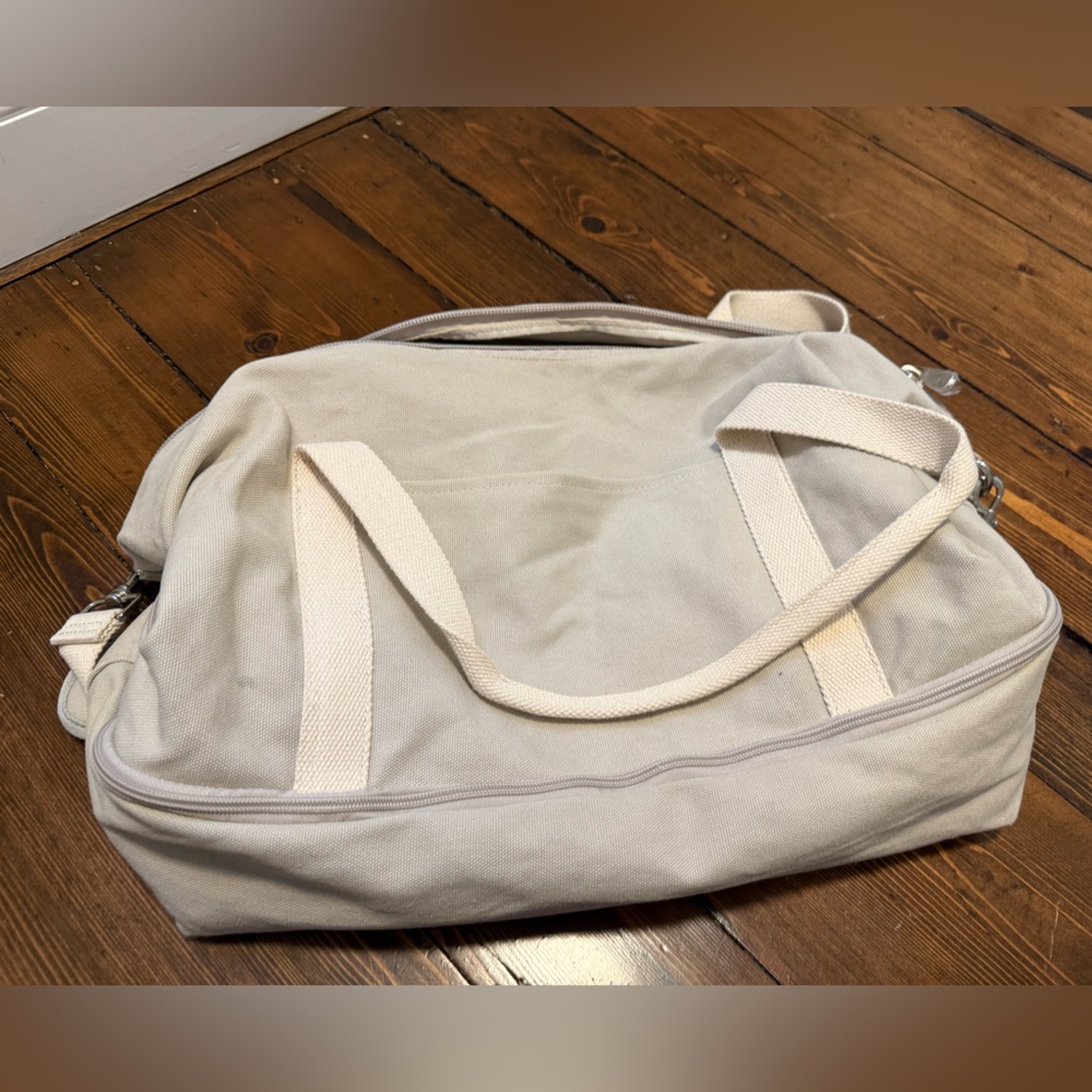 Lo & Sons Cream Duffel Bag with Minimalist Design